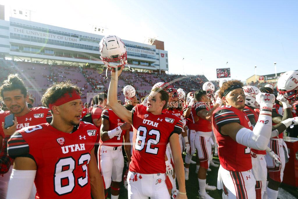 Utah wide receiver Dylan Slavens (82) celebrates with his teammate following their victory over Idaho State during an NCAA college football game Saturday, Sept. 14, 2019, in Salt Lake City. (AP Photo/Rick Bowmer)