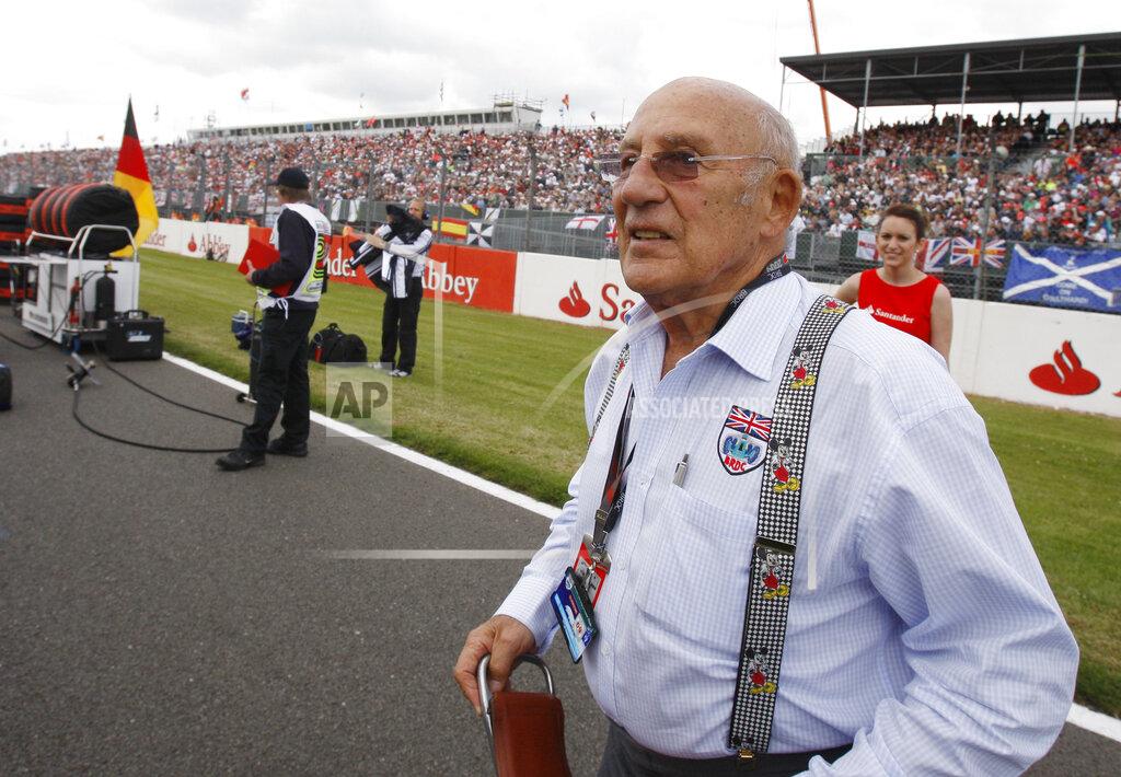 Luca Bruno FILE - In this file photo dated Sunday, June 21 2009, Stirling Moss, the legendary British Racing driver attends the British Formula One Grand Prix at the Silverstone racetrack, in Silverstone, England. Stirling Moss has died at the age of 90, according to an announcement Sunday April 12, 2020, from his family. (AP Photo/Luca Bruno, FILE)