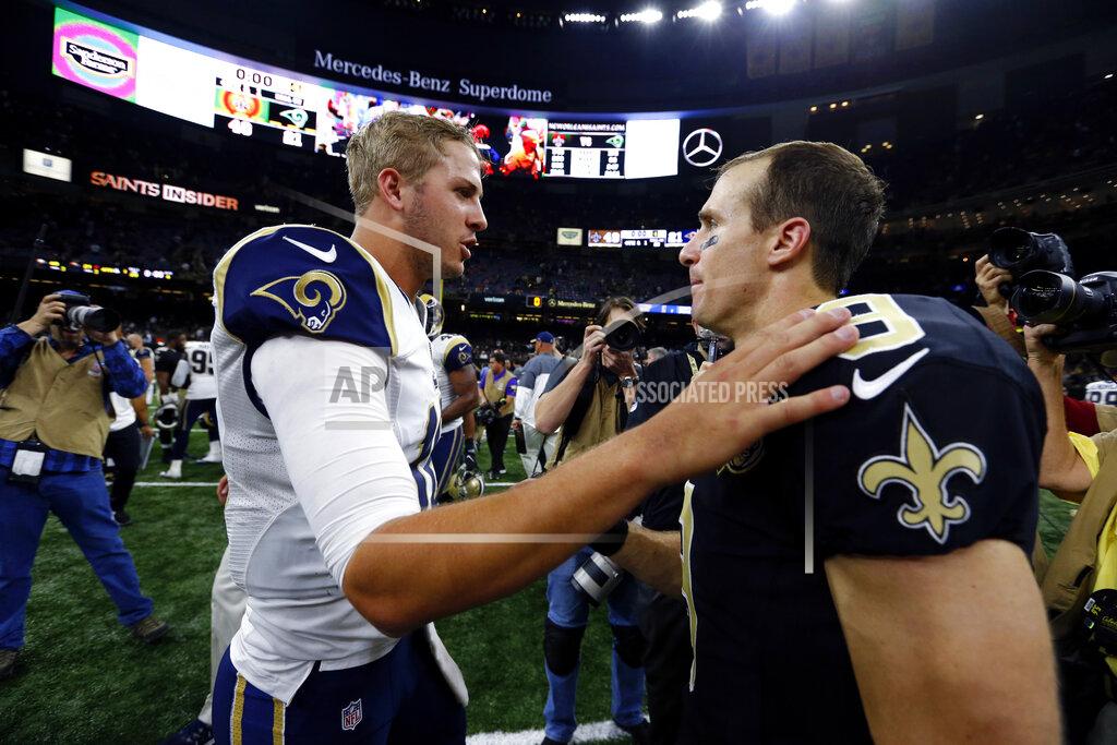 Butch Dill FILE - In this Nov. 27, 2016, file photo, New Orleans Saints quarterback Drew Brees (9) greets Los Angeles Rams quarterback Jared Goff after an NFL football game in New Orleans. The Rams and Saints will play in the NFC conference championship on Sunday, Jan. 20, in New Orleans. (AP Photo/Butch Dill, File)