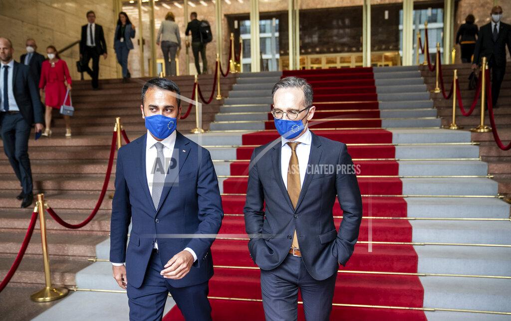 Michael Kappeler German Foreign Minister Heiko Maas, right, and his Italian counterpart Luigi Di Maio wear face masks to protect against the coronavirus during a meeting in Berlin, Germany, Friday, June 5, 2020. (Michael Kappeler/Pool via AP)