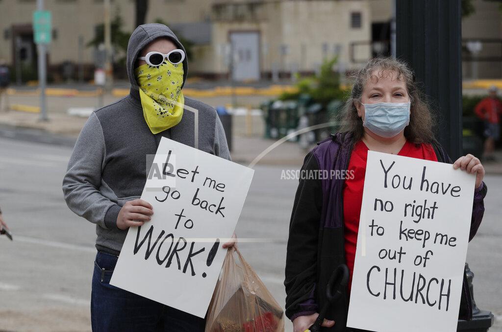 Eric Gay Protesters rally at the Texas State Capitol to speak out against Texas' handling of the COVID-19 outbreak, in Austin, Texas, Saturday, April 18, 2020. Austin and many other Texas cities remain under stay-at-home orders due to the coronavirus outbreak except for essential personnel. (AP Photo/Eric Gay)