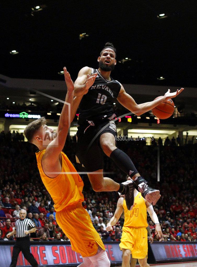 Andres Leighton Nevada forward Caleb Martin (10) is fouled by New Mexico's Vladimir Pinchuk, left, of Germany, during the first half of an NCAA college basketball game in Albuquerque, N.M., Saturday, Jan. 5, 2019. (AP Photo/Andres Leighton)