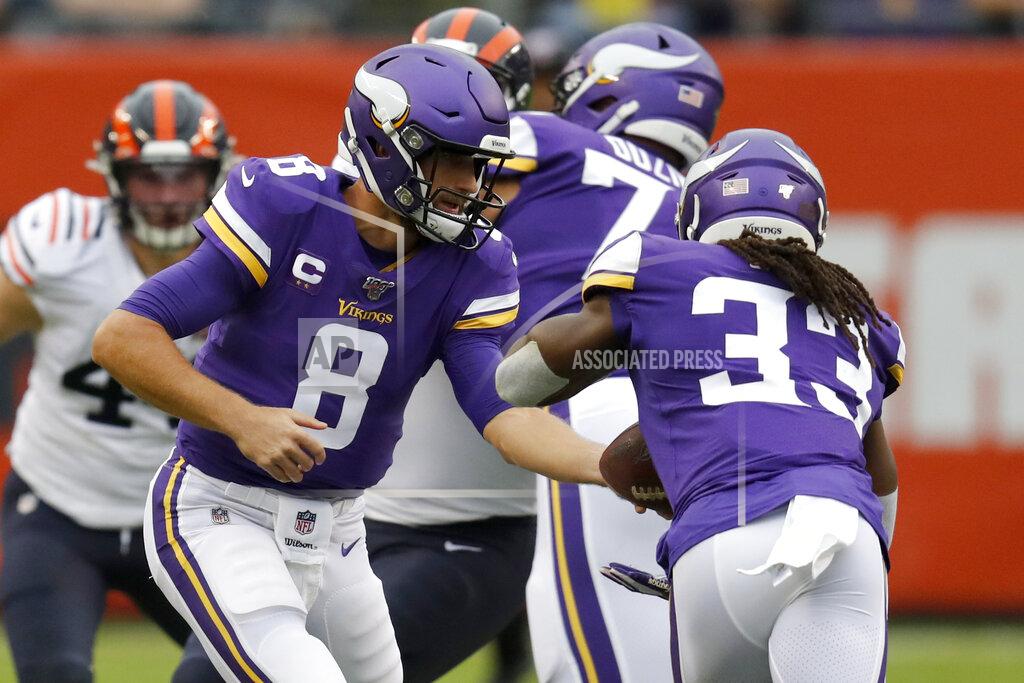 Charles Rex Arbogast Minnesota Vikings quarterback Kirk Cousins (8) hands off to running back Dalvin Cook (33) during the half of an NFL football game against the Chicago Bears Sunday, Sept. 29, 2019, in Chicago. (AP Photo/Charles Rex Arbogast)
