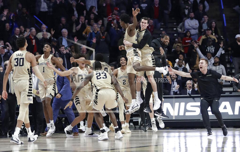 Chuck Burton Wake Forest players celebrate after defeating North Carolina State 71-67 in an NCAA college basketball game in Winston-Salem, N.C., Tuesday, Jan. 15, 2019. (AP Photo/Chuck Burton)