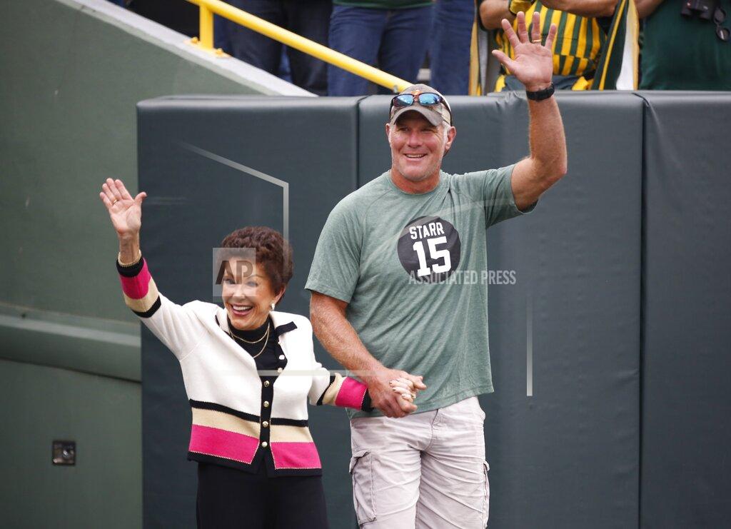 Matt Ludtke Former Green Bay Packers quarterback Brett Favre escorts Cherry Louise Morton, wife of former Green Bay Packers Bart Starr out of the tunnel before an NFL football game between the Green Bay Packers and the Minnesota Vikings Sunday, Sept. 15, 2019, in Green Bay, Wis. (AP Photo/Matt Ludtke)