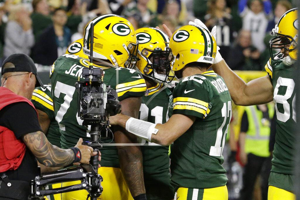 Mike Roemer Green Bay Packers wide receiver Geronimo Allison (81) celebrates a catch for a touchdown with quarterback Aaron Rodgers (12) and offensive guard Elgton Jenkins (74) during the first half of an NFL football game against the Philadelphia Eagles on Thursday, Sept. 26, 2019, in Green Bay, Wis. (AP Photo/Mike Roemer)