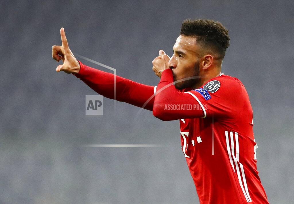 Matthias Schrader Bayern Munich's Corentin Tolisso celebrates after scoring his team's third goal during the Champions League Group A soccer match between Bayern Munich and Atletico Madrid at the Allianz Arena in Munich, Germany, Wednesday, Oct. 21, 2020. (AP Photo/Matthias Schrader,Pool)