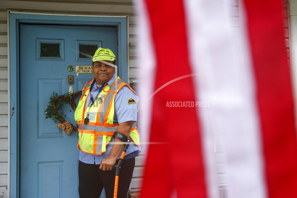 Matt Slocum Patrice Jetter, a furloughed school crossing guard, poses for a photograph, Thursday, July 23, 2020, in Hamilton, N.J. Jetter, who has cerebral palsy and partial hearing loss, wanted to work with kids when graduating from high school. (AP Photo/Matt Slocum)