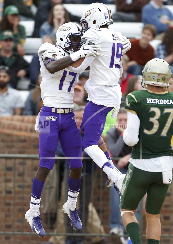 Daniel Sangjib Min James Madison's Kyndel Dean, left, celebrates a touchdown with teammate Devin Ravenel during the second half of an NCAA college football game in Williamsburg, Va., on Saturday, Oct. 19, 2019. (Daniel Sangjib Min/Richmond Times-Dispatch via AP)