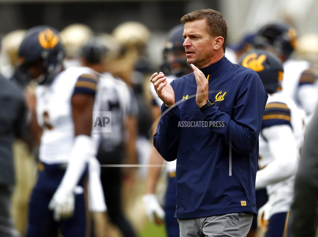 David Zalubowski FILE - In this Oct. 28, 2017, file photo, California head coach Justin Wilcox claps during the first half of an NCAA college football game in Boulder, Colo. Wilcox has signed a new five-year deal to stay under contract with the school through the 2023 season. The deal signed Thursday, Dec. 6 2018, adds two more years to the original contract signed in 2017. (AP Photo/David Zalubowski, File)