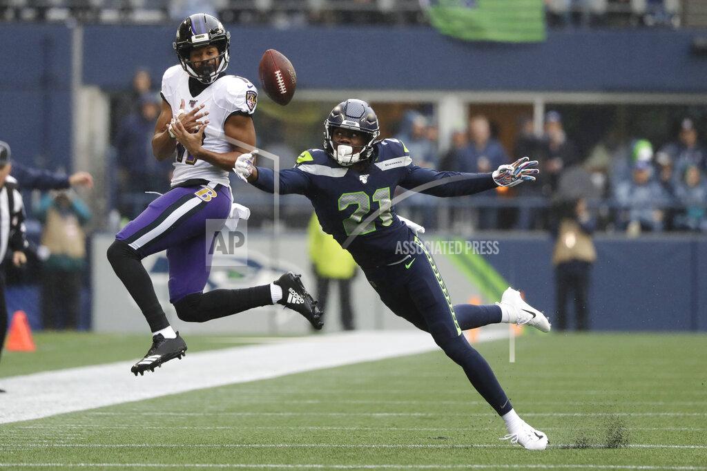 Elaine Thompson Seattle Seahawks cornerback Tre Flowers (21) tips a pass intended for Baltimore Ravens Seth Roberts (11) for an incomplete during the first half of an NFL football game, Sunday, Oct. 20, 2019, in Seattle. (AP Photo/Elaine Thompson)