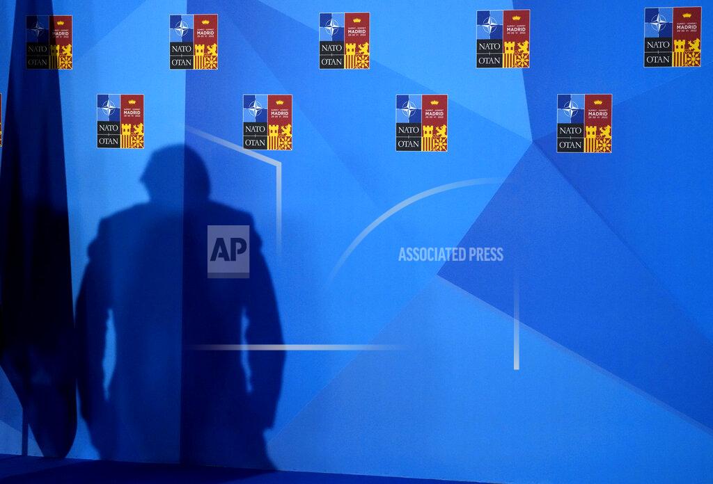 Paul White A shadow is cast on the wall from a stage light as British Prime Minister Boris Johnson arrives for a media conference at a NATO summit in Madrid, Spain on Thursday, June 30, 2022. North Atlantic Treaty Organization heads of state met for the final day of a NATO summit in Madrid on Thursday. (AP Photo/Paul White)