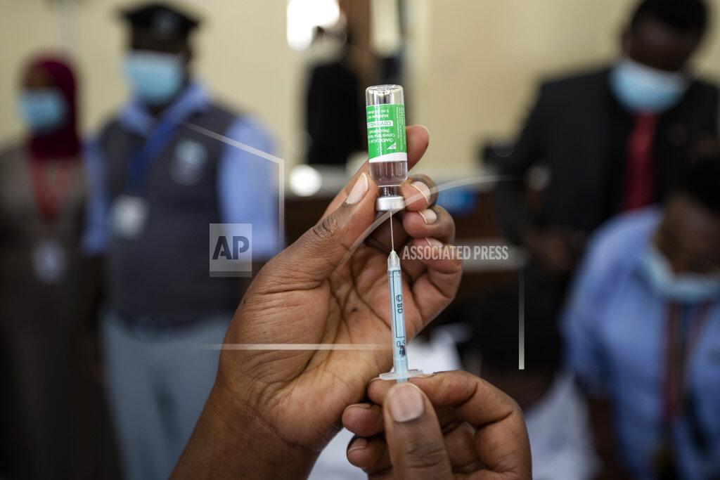 Ben Curtis FILE - In this Friday, March 5, 2021 file photo, a nurse prepares to administer a dose of the AstraZeneca COVID-19 vaccine manufactured by the Serum Institute of India and provided through the global COVAX initiative, at Kenyatta National Hospital in Nairobi, Kenya. African health officials and the United Nations warned Thursday, Oct. 28, 2021 of a looming shortage of up to 2 billion syringes for mainly low- and middle-income countries around the world. (AP Photo/Ben Curtis, File)