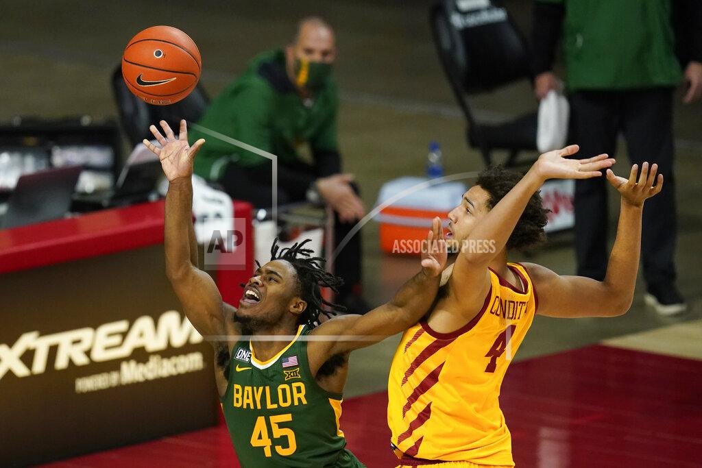 Charlie Neibergall Baylor guard Davion Mitchell (45) is fouled by Iowa State forward George Conditt IV while driving to the basket during the second half of an NCAA college basketball game, Saturday, Jan. 2, 2021, in Ames, Iowa. Baylor won 76-65. (AP Photo/Charlie Neibergall)