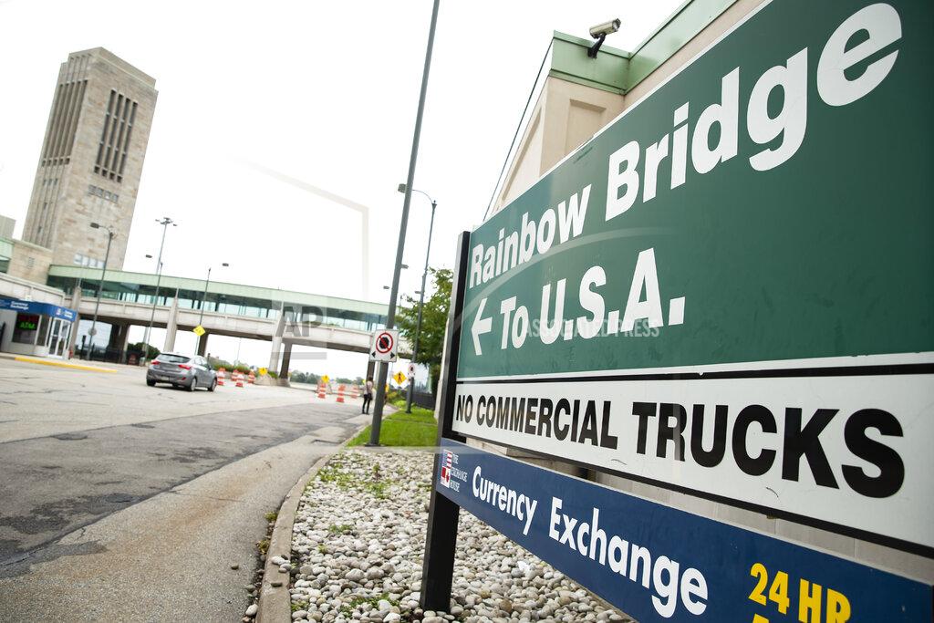 Aaron Lynett A vehicle crosses the International Rainbow Bridge from Niagara Falls, Ont. into Niagara Falls, N.Y. on Wednesday, Oct. 13, 2021. The U.S. will reopen its land borders to nonessential travel next month, ending a 19-month freeze due to the COVID-19 pandemic as the country moves to require all international visitors to be vaccinated against the coronavirus. The new rules, to be announced Wednesday, Oct. 13, 2021 will allow fully vaccinated foreign nationals to enter the U.S. regardless of the reason for travel. (Aaron Lynett/The Canadian Press via AP)
