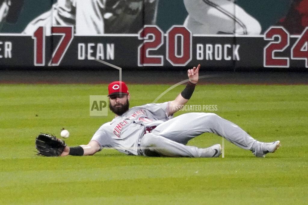 Jeff Roberson Cincinnati Reds left fielder Jesse Winker is unable to catch a single by St. Louis Cardinals' Kolten Wong during the third inning of a baseball game Saturday, Aug. 22, 2020, in St. Louis. (AP Photo/Jeff Roberson)