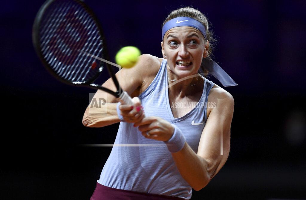 Thomas Kienzle Petra Kvitova of the Czech Republic returns the ball to Jennifer Brady of the United States during their match at the WTA tennis tournament in Stuttgart, Germany, Tuesday, April 20, 2021. (Thomas Kienzle/Pool via AP)