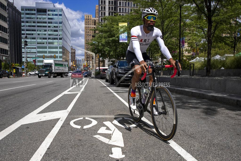 Alejandro A. Alvarez Siddeeq Shabazz rides his bicycle by Philadelphia City Hall on Friday, Sept. 3, 2021. Shabazz got into cycling because of the pandemic. Now he rides 200 miles a week, leads team rides and has been on the cover of a bicycling publication. (Alejandro A. Alvarez/The Philadelphia Inquirer via AP)
