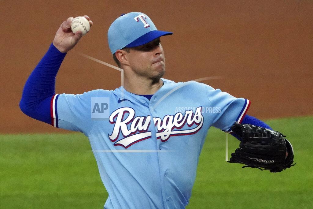 Louis Deluca FILE - In this July 26, 2020, file photo, Texas Rangers starting pitcher Corey Kluber pitches against the Colorado Rockies in the first inning of a baseball game in Arlington, Texas. The Rangers on Friday, Oct. 30, 2020, declined the $18 million contract option on Kluber, who lasted just one inning in his only start before a shoulder injury ended his season. Kluber gets a $1 million buyout, and the club has said it is interested in re-signing Kluber to a less expensive deal. (AP Photo/Louis DeLuca, File)