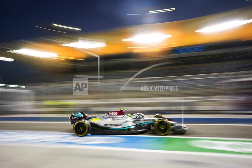 Hassan Ammar Mercedes driver Lewis Hamilton of Britain steers his car during a practice for theFormula One Bahrain Grand Prix it in Sakhir, Bahrain, Friday, March 18, 2022. (AP Photo/Hassan Ammar)