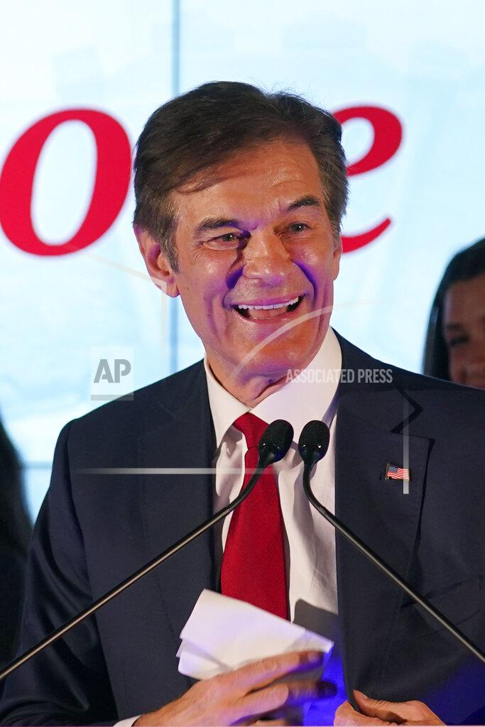 Seth Wenig Mehmet Oz, a Republican candidate for U.S. Senate in Pennsylvania, speaks to supporters at a primary night election gathering in Newtown, Pa., Tuesday, May 17, 2022. (AP Photo/Seth Wenig)