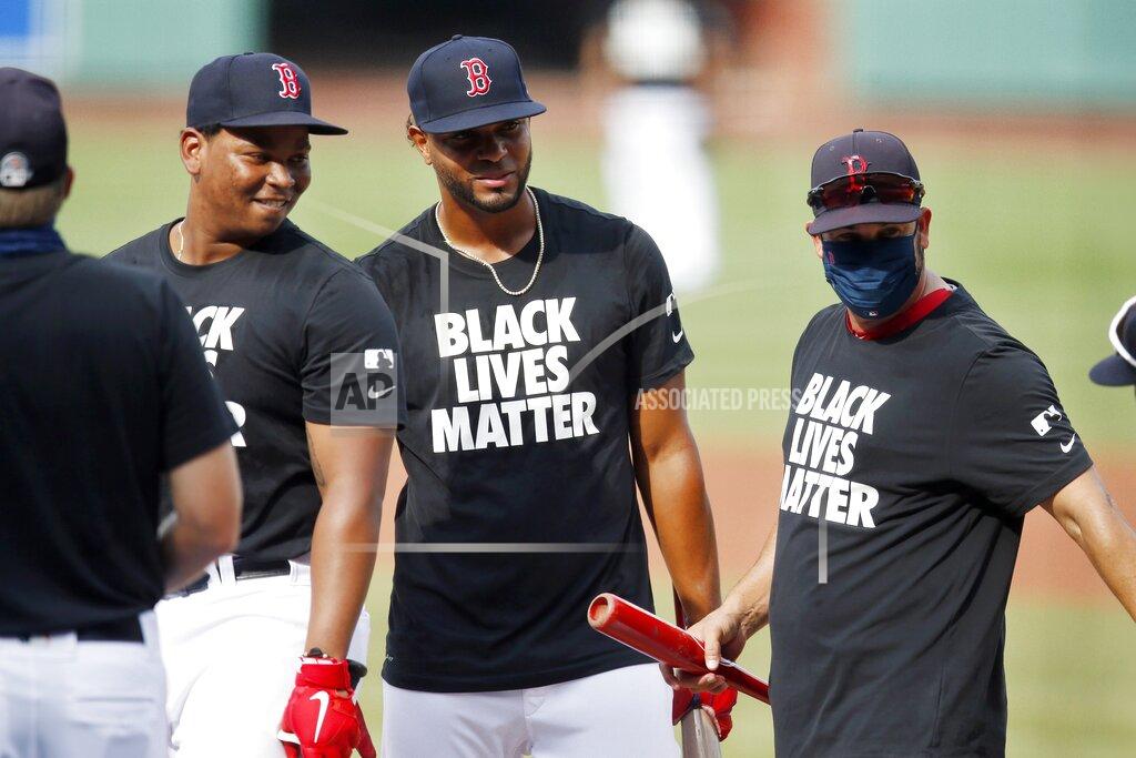 Michael Dwyer Boston Red Sox's Rafael Devers, left, and Xander Bogaerts, center, wear Black Lives Matter jerseys during warmups before an opening day baseball game against the Baltimore Orioles at Fenway Park, Friday, July 24, 2020, in Boston. (AP Photo/Michael Dwyer)