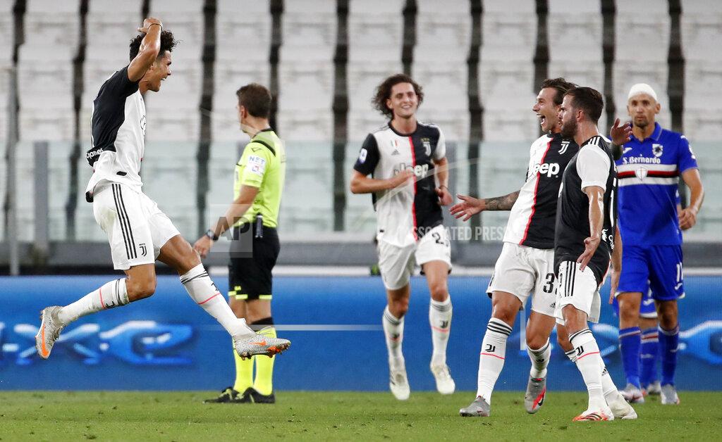Antonio Calanni Juventus' Cristiano Ronaldo, left, celebrates after scoring his team's first goal during the Serie A soccer match between Juventus and Sampdoria at the Allianz stadium in Turin, Italy, Sunday, July 26, 2020. (AP Photo/Antonio Calanni)