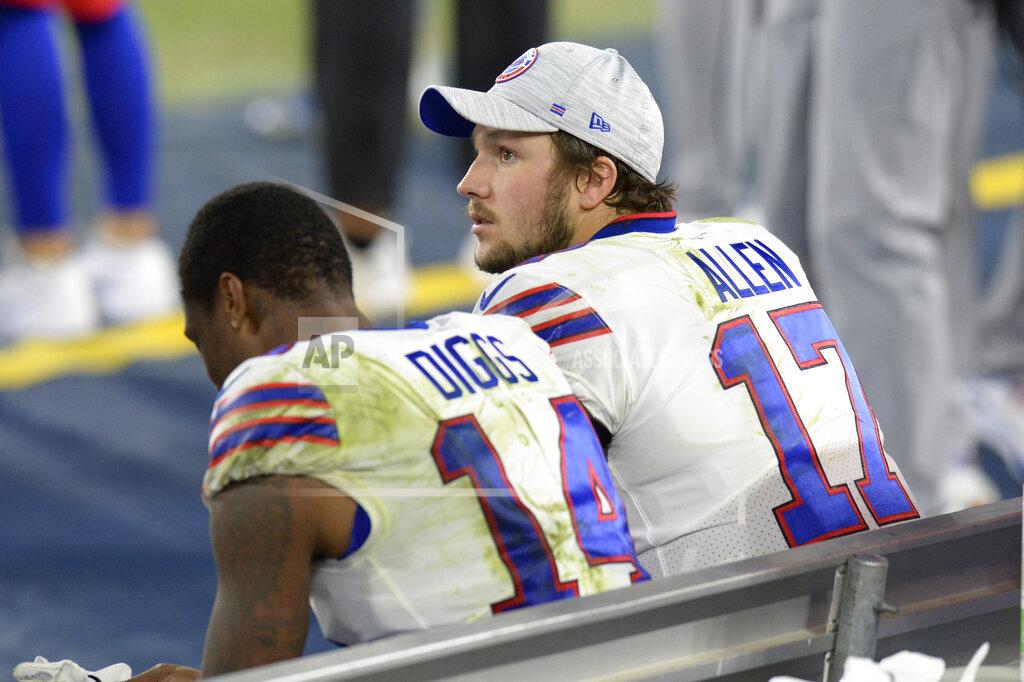 Mark Zaleski Buffalo Bills quarterback Josh Allen (17) and wide receiver Stefon Diggs (14) sit on the bench in the second half of an NFL football game against the Tennessee Titans Tuesday, Oct. 13, 2020, in Nashville, Tenn. The Titans won 42-16. (AP Photo/Mark Zaleski)