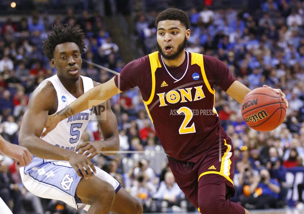 Paul Vernon Iona's E.J. Crawford (2) drives past North Carolina's Nassir Little (5) in the first half during a first round men's college basketball game in the NCAA Tournament in Columbus, Ohio, Friday, March 22, 2019. (AP Photo/Paul Vernon)