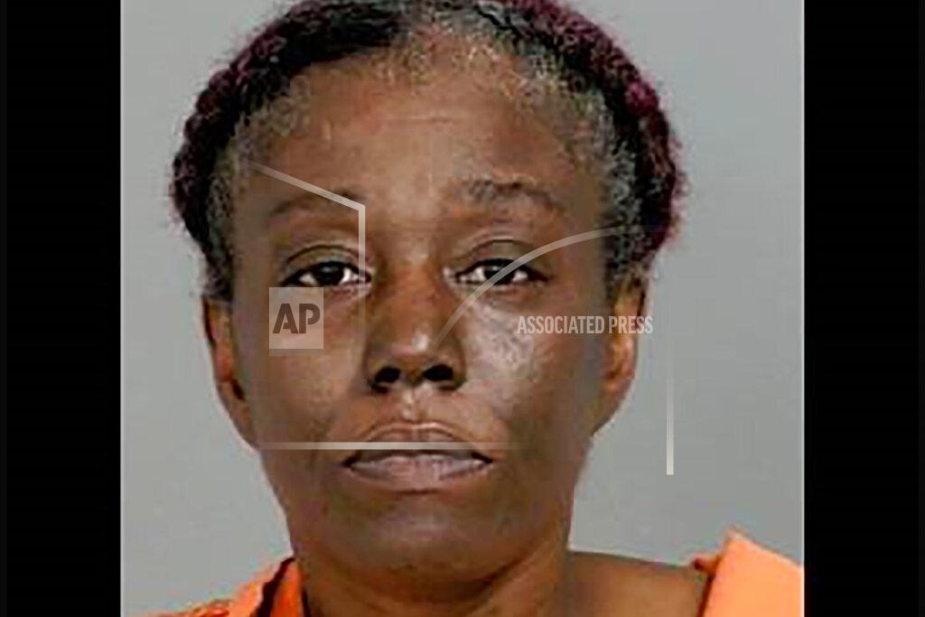 Uncredited This undated booking photo provided by the Genesee County prosecutor's office shows Sharmel Teague. State police are investigating whether a security guard, Calvin Munerlyn, 43, at a Flint, Mich., Family Dollar store was fatally shot because he refused to allow a customer to enter without wearing a face mask to protect against transmission of the coronavirus. Teague, who is in custody, her husband Larry Teague, and her adult son Ramonyea Bishop, both fugitives, have been charged in the fatal shooting of Munerlyn. (Genesee County Prosecutor's Office via AP)