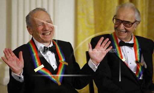 FILE - Kennedy Center honorees Mel Brooks, left, works the crowd as Dave Brubeck laughs at the White House in Washington on Dec. 6, 2009. Brooks released a memoir, "All About Me!: My Remarkable Life in Show Business." (AP Photo/Alex Brandon, File)