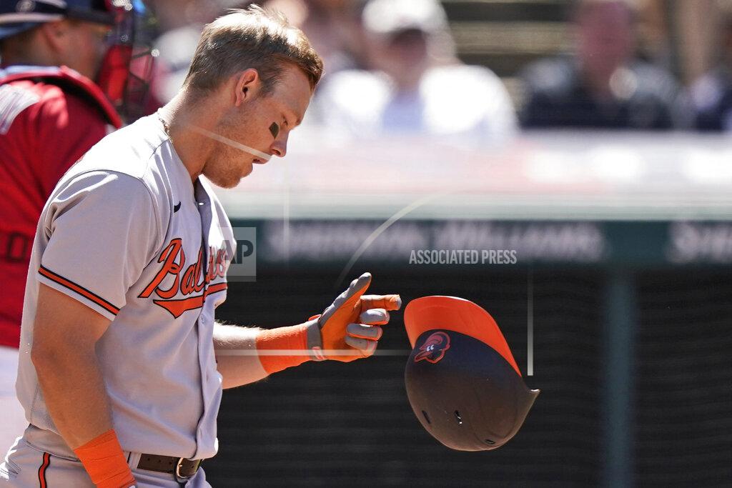 Tony Dejak Baltimore Orioles' Pat Valaika drops his helmet after striking out in the eighth inning of a baseball game against the Cleveland Indians, Thursday, June 17, 2021, in Cleveland. (AP Photo/Tony Dejak)