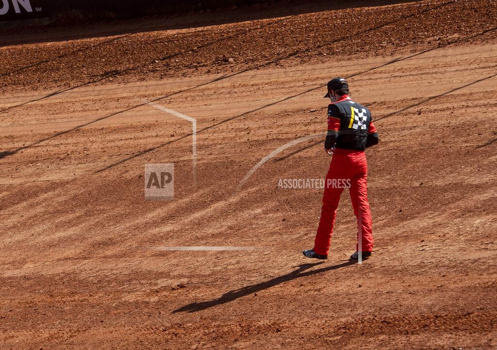 David Crigger Nascar Cup Series driver Ryan Blaney walks around a section of the new dirt track, Friday, March 26, 2021, at Bristol Motor Speedway in Bristol, Tenn. (David Crigger/Bristol Herald Courier via AP)