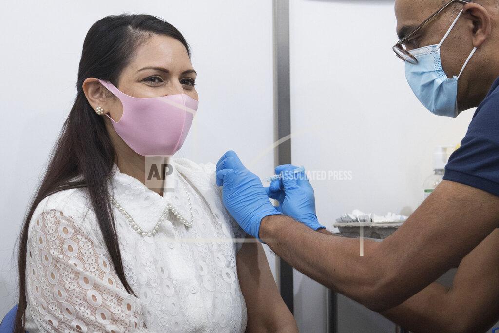 Stefan Rousseu Britain's Home Secretary Priti Patel receives her first dose of the Moderna Covid-19 vaccine from Dr. Vin Diwakar at Guys Hospital in London, Saturday May 15, 2021. (Stefan Rousseu/PA via AP)