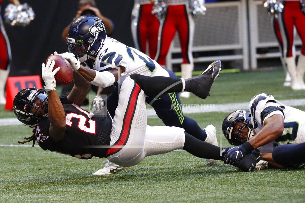 John Bazemore Seattle Seahawks defensive back Marquise Blair (27) strips the ball from Atlanta Falcons running back Devonta Freeman (24) during the second half of an NFL football game, Sunday, Oct. 27, 2019, in Atlanta. Seattle Seahawks recovered on the play. (AP Photo/John Bazemore)