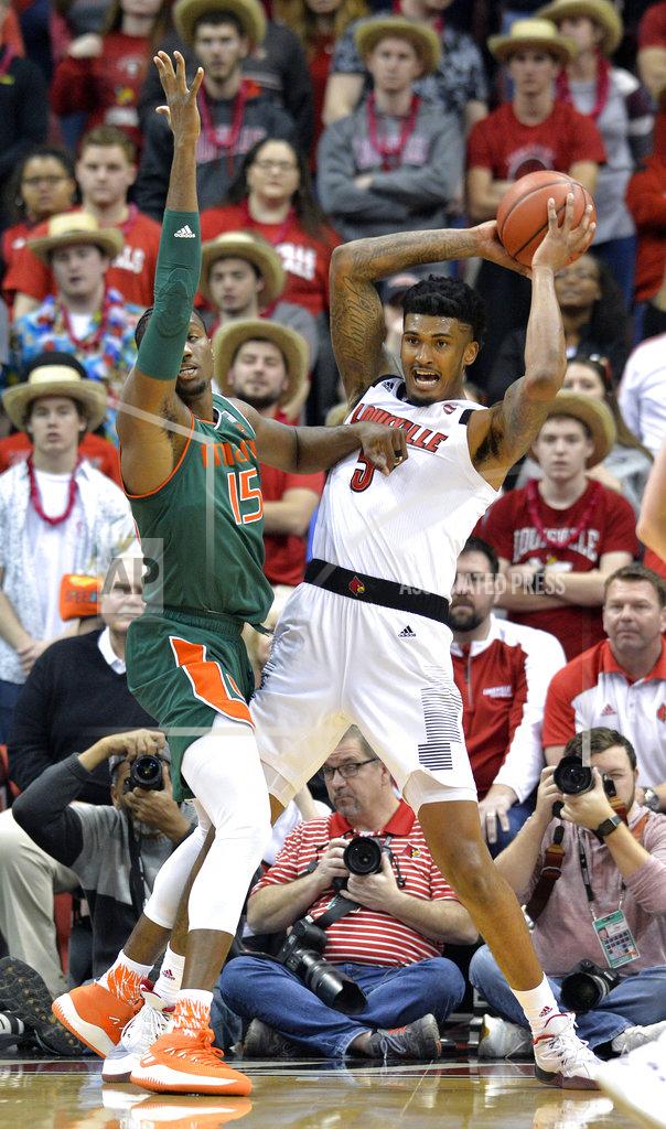Timothy D. Easley Louisville center Malik Williams (5) looks for help from the defense of Miami center Ebuka Izundu (15) during the first half of an NCAA college basketball game in Louisville, Ky., Sunday, Jan. 6, 2019. (AP Photo/Timothy D. Easley)