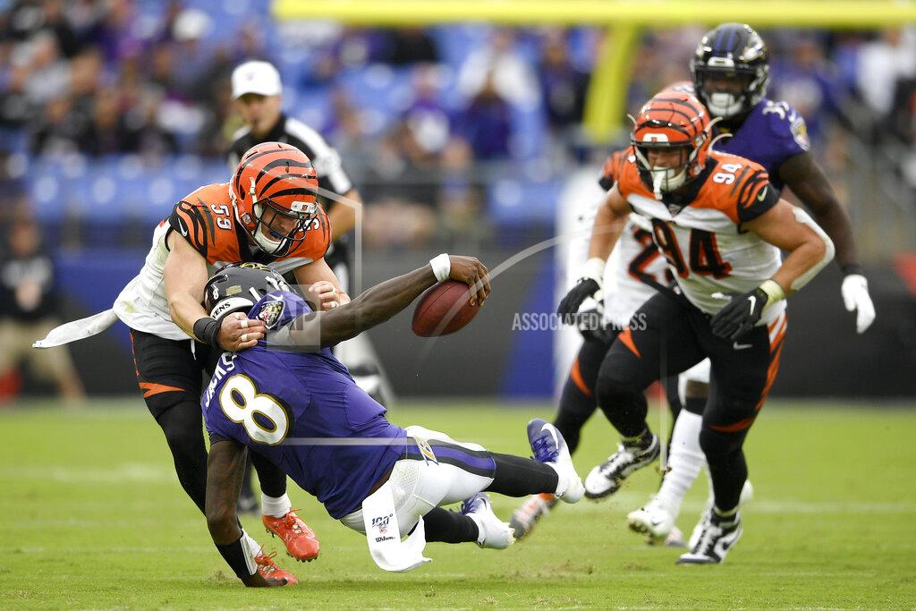 Nick Wass Cincinnati Bengals outside linebacker Nick Vigil (59) makes a hit on Baltimore Ravens quarterback Lamar Jackson (8) during the second half of a NFL football game Sunday, Oct. 13, 2019, in Baltimore. (AP Photo/Nick Wass)