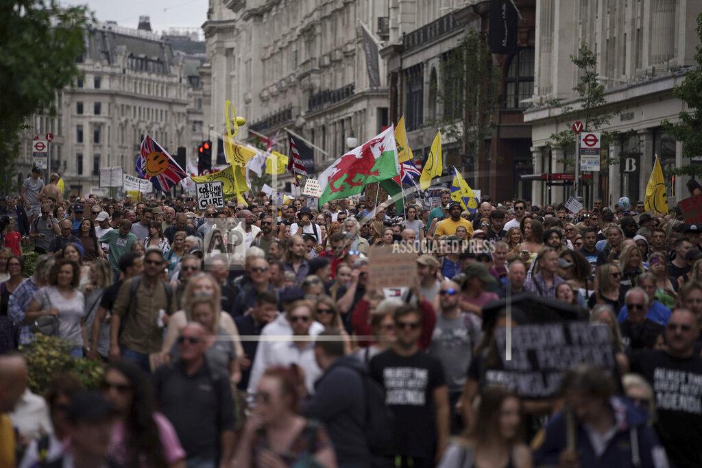 Aaron Chown Protesters match during an anti-lockdown protest, in central London, Saturday June 26, 2021. (Aaron Chown/PA via AP)