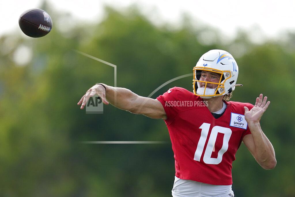 Ashley Landis Los Angeles Chargers quarterback Justin Herbert (10) participates in drills at the NFL football team's practice facility in Costa Mesa, Calif. Monday, Aug. 1, 2022. (AP Photo/Ashley Landis)