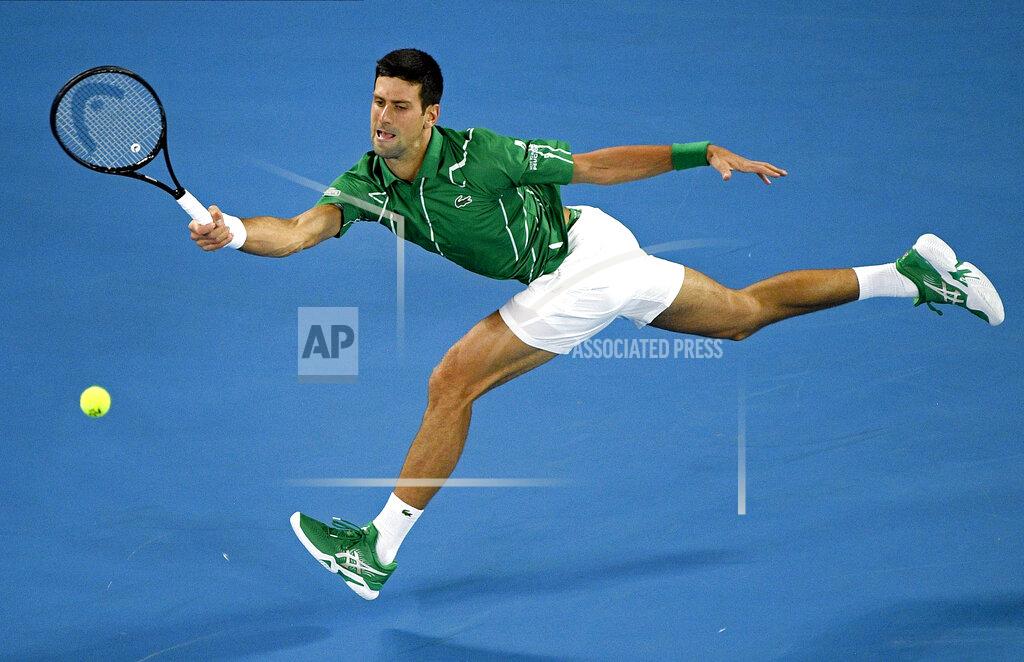 Andy Brownbill FILE - In this Monday, Jan. 20, 2020, file photo, Serbia's Novak Djokovic makes a forehand return to Germany's Jan-Lennard Struff during their first round singles match the Australian Open tennis championship in Melbourne, Australia. Djokovic is scheduled to play in the U.S. Open, scheduled for Aug. 31-Sept. 13, 2020. (AP Photo/Andy Brownbill, File)