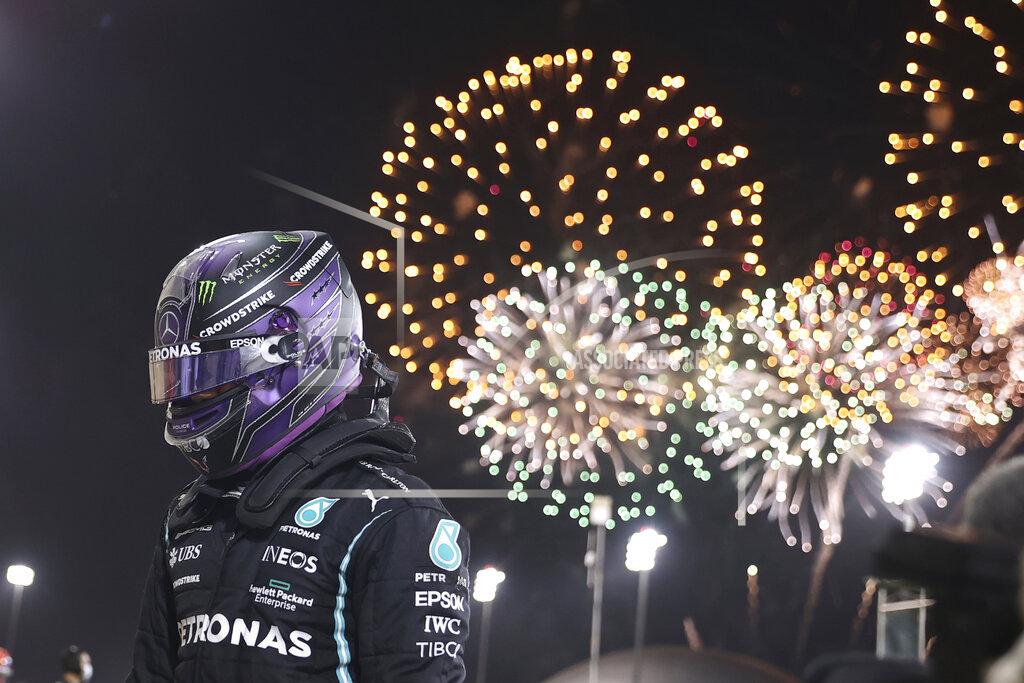 Lars Baron Mercedes driver Lewis Hamilton of Britain celebrates after winning the Bahrain Formula One Grand Prix at the Bahrain International Circuit in Sakhir, Bahrain, Sunday, March 28, 2021. (Lars Baron, Pool via AP)
