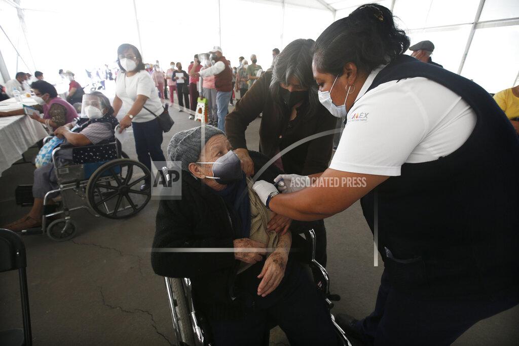 Marco Ugarte An elderly woman gets her Sinovac Biotech COVID-19 vaccine at the Americas sports center in Ecatepec, a borough on the outskirts of Mexico City, Tuesday, Feb. 23, 2021. (Foto AP/Marco Ugarte