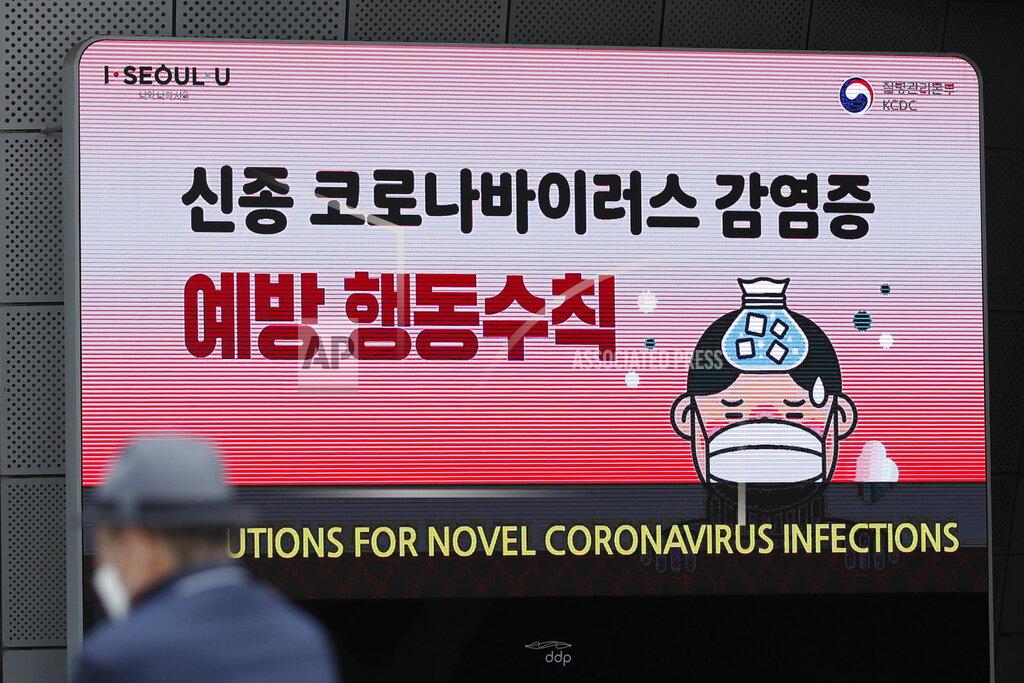 Lee Jin-Man A man wearing a face mask sits near a screen showing precautions against the new coronavirus in Seoul, South Korea, Tuesday, May 12, 2020. As South Korea grapples with a new spike in coronavirus infections thought to be linked to nightspots in Seoul, including several popular with gay men, it's also seeing rising homophobia that's making it difficult for sexual minorities to come forward for diagnostic tests. (AP Photo/Lee Jin-man)