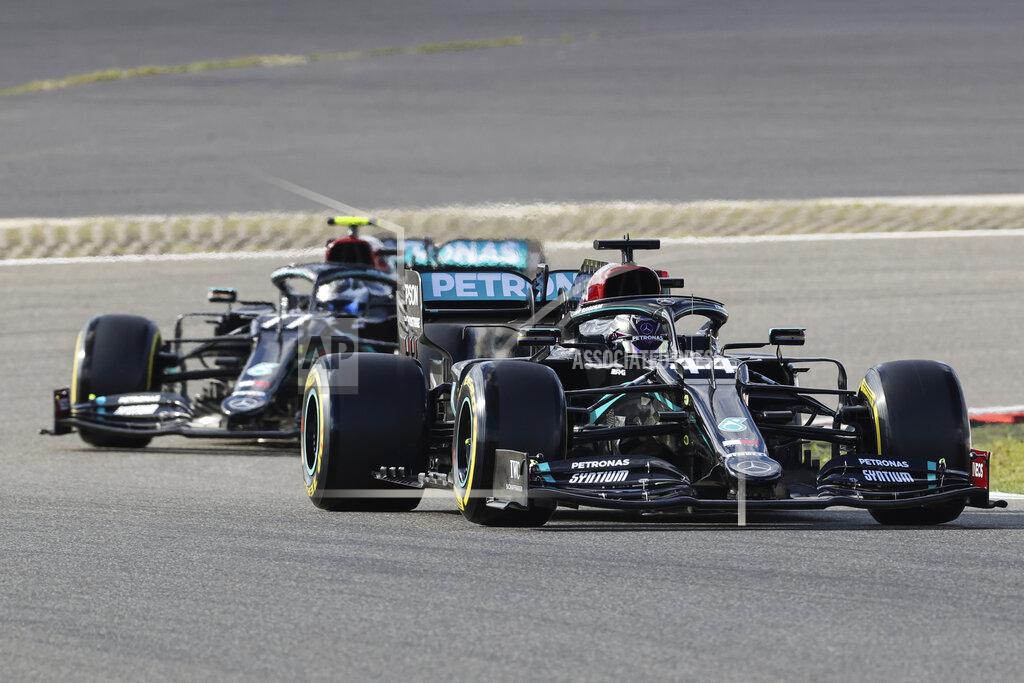 Wolfgang Rattay Mercedes driver Lewis Hamilton of Britain leads his teammate Mercedes driver Valtteri Bottas of Finland during the qualifying session for the Eifel Formula One Grand Prix at the Nuerburgring racetrack in Nuerburg, Germany, Saturday, Oct. 10, 2020. The Germany F1 Grand Prix will be held on Sunday. (Wolfgang Rattay, Pool via AP)