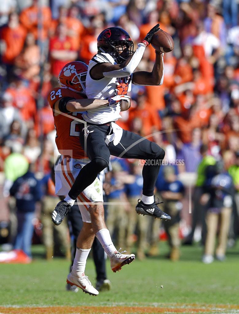 Richard Shiro Louisville's Dez Fitzpatrick catches a pass while defended by Clemson's Nolan Turner during the second half of an NCAA college football game Saturday, Nov. 3, 2018, in Clemson, S.C. Clemson won 77-16. (AP Photo/Richard Shiro)