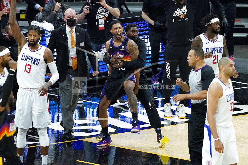 Matt York Phoenix Suns' Cameron Payne, center left, celebrates with teammates during the second half of Game 2 of the NBA basketball Western Conference Finals against the Los Angeles Clippers, Tuesday, June 22, 2021, in Phoenix. (AP Photo/Matt York)