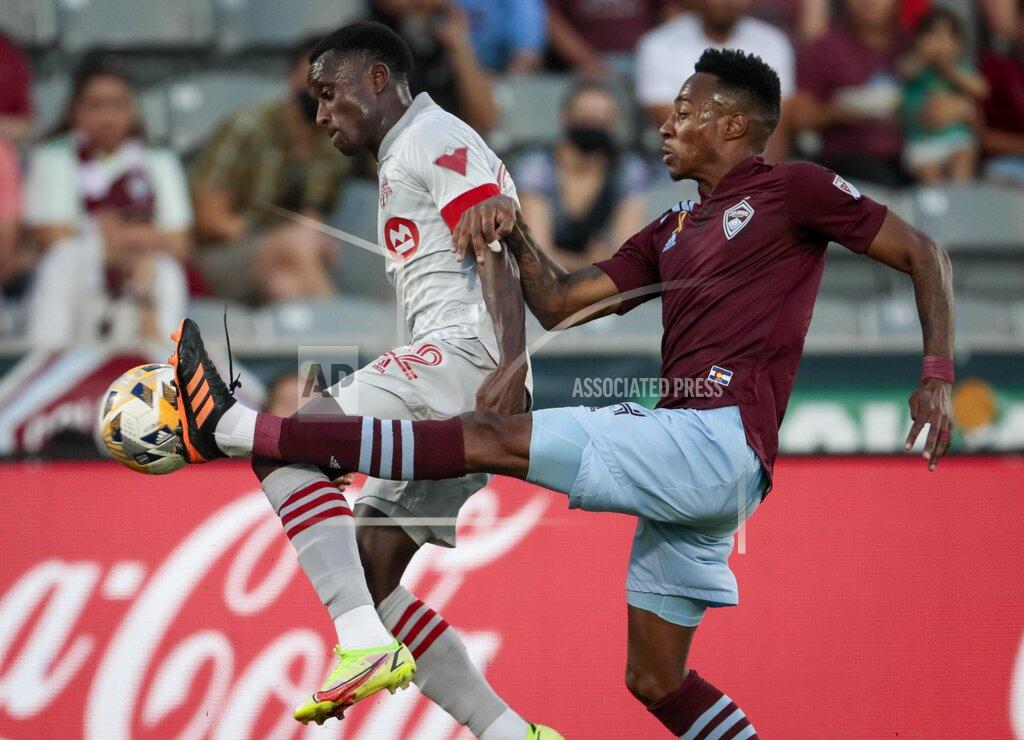 Joe Mahoney Toronto FC midfielder Richie Laryea (22) leaps for the ball against Colorado Rapids midfielder Mark-Anthony Kaye in the first half of an MLS soccer game in Denver, Saturday, Sept. 25, 2021. (AP Photo/Joe Mahoney)