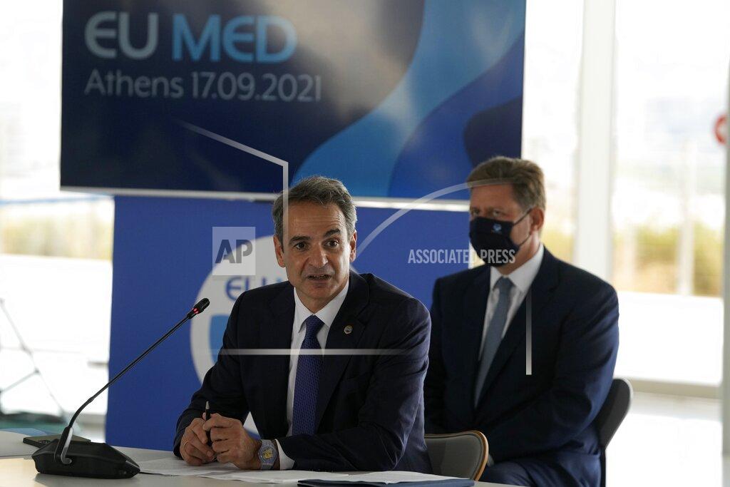 Thanassis Stavrakis Greek Prime Minister Kyriakos Mitsotakis attends the EUMED 9 summit at the Stavros Niarchos Foundation Cultural Center in Athens, Friday, Sept. 17, 2021. Nine European countries on the Mediterranean are holding a summit in Athens to discuss issues ranging from climate change and the pandemic response to migration and Afghanistan. (AP Photo/Thanassis Stavrakis)