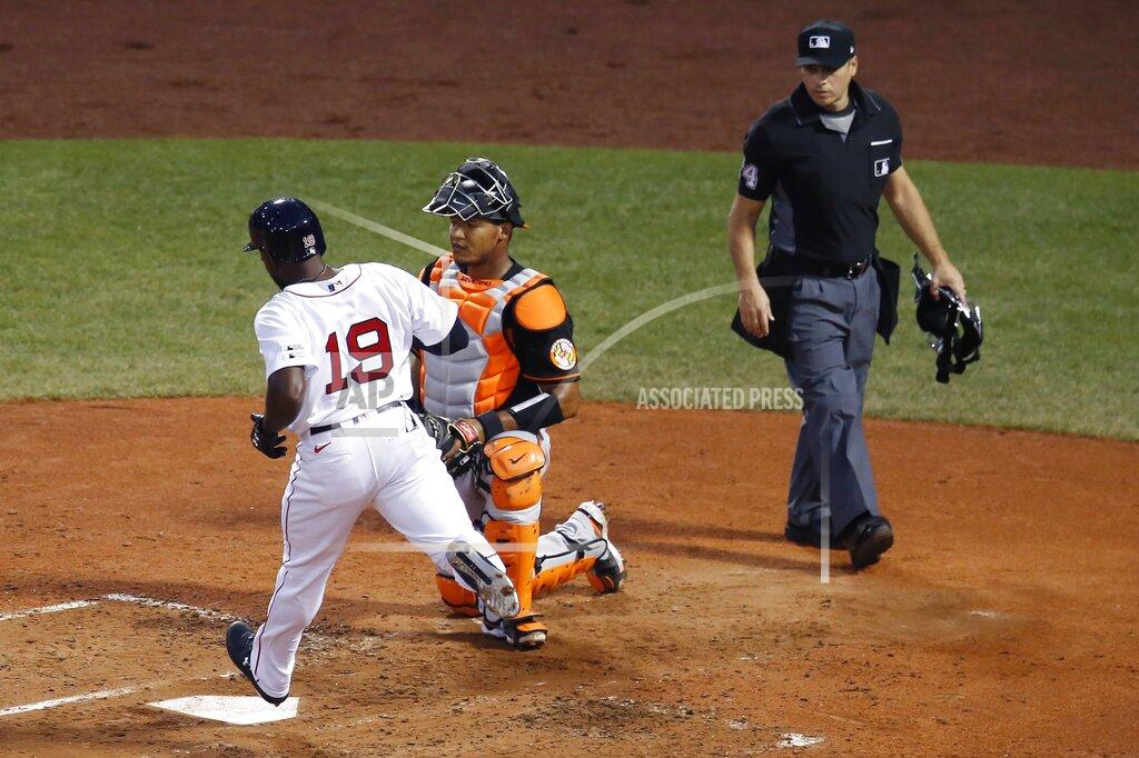 Michael Dwyer Boston Red Sox's Jackie Bradley Jr. (19) scores in front of Baltimore Orioles' Pedro Severino on a double by Jose Peraza during the third inning of an opening day baseball game at Fenway Park, Friday, July 24, 2020, in Boston. (AP Photo/Michael Dwyer)