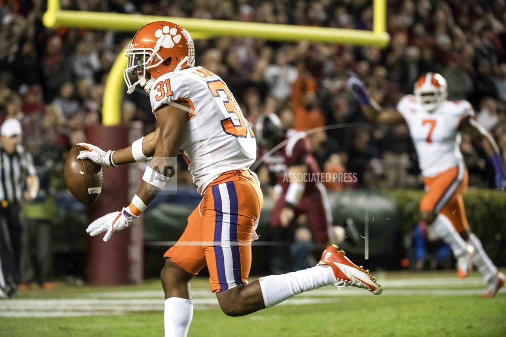 Clemson cornerback Ryan Carter (31) scores a touchdown after intercepting a pass against South Carolina during the first half of an NCAA college football game Saturday, Nov. 25, 2017, in Columbia, S.C. (AP Photo/Sean Rayford)